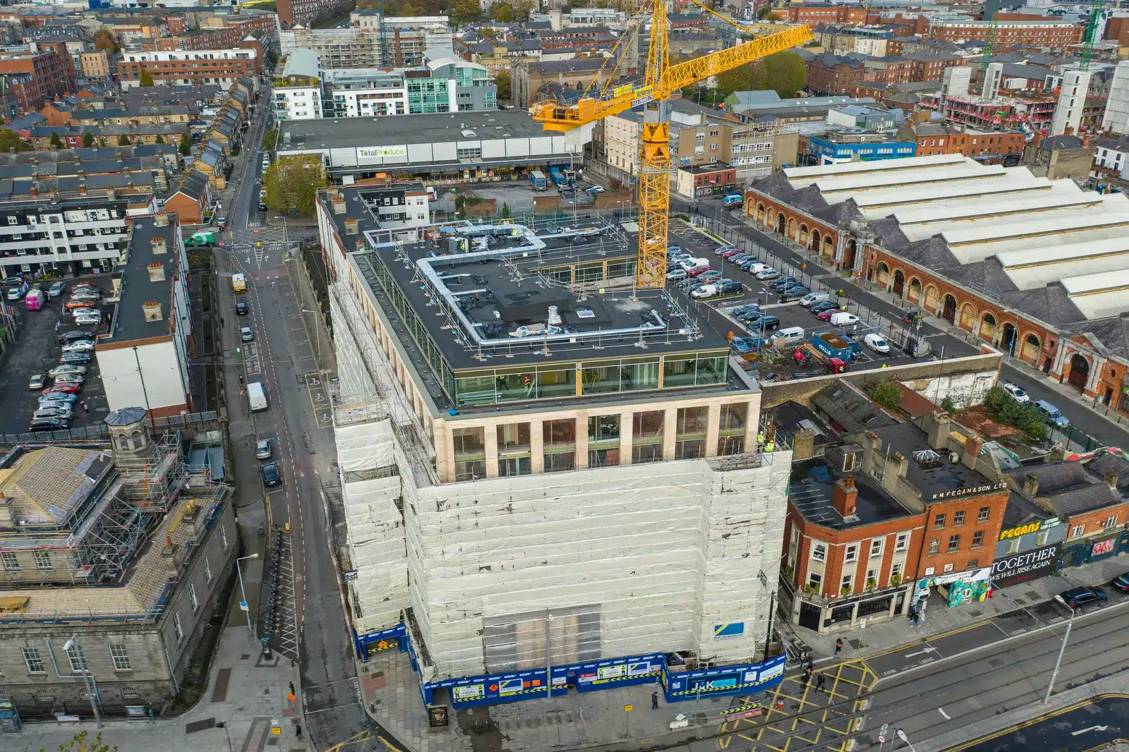 Drone Construction Monitoring 3 Drone view of a mid-rise city-centre building under construction with a tower crane, Ireland